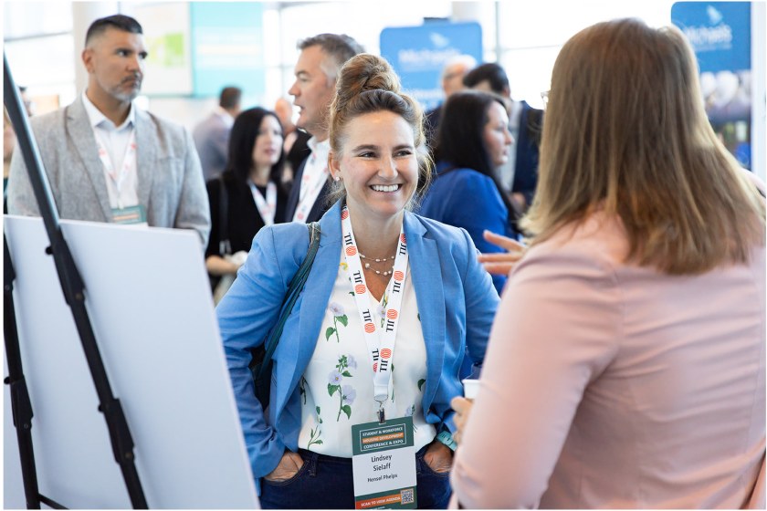 Attendees networking at the conference